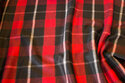 Frakkestof i sort og rød tern