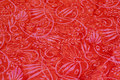 Batik-bomuld i rød og rosa