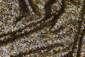 Paillet-stof med tætsiddende pailletter i sølv og guld