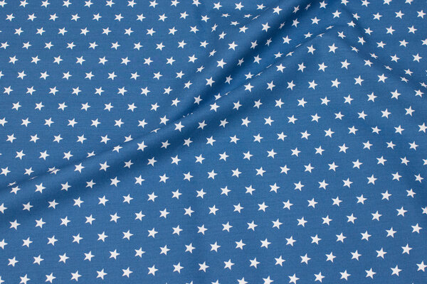 Mellemblå bomuld med ca. 1 cm hvide stjerner
