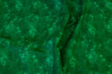 Bomuld med batiktryk i grønne nuancer