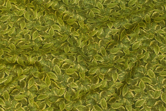 Patchwork-bomuld i grøn og guld med bladmønster