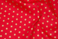 Kraftig rød deko- bomuld med 1 cm guldstjerner