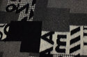 Filtet uld i sort og grå med store geometriske mønstre